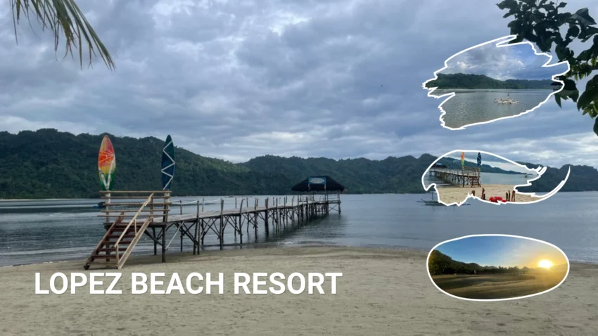 Lopez Beach Resort in Sipalay with a wide sandy shoreline, a long wooden pier extending over calm water, colorful windsurfing sails, and forested hills beneath a cloudy sky.